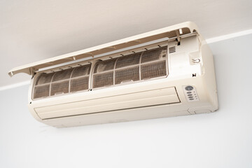 Dirty in dust and mold air conditioner filter close-up. Home air conditioner maintenance