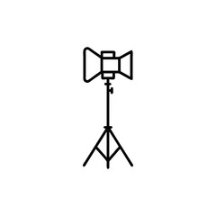 Vector art of a professional studio spotlight on a tripod symbolizing creative lighting