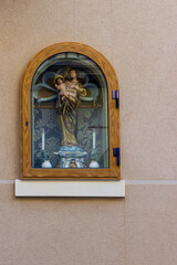 Religious Statue of Madonna and Child Displayed in an Elegant Wooden Frame