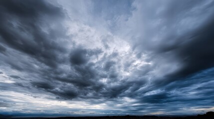 The dramatic clouds capture the beauty of the stormy sky at dusk