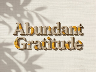 The phrase "Abundant Gratitude" in textured font, adorned with corn patterns, is displayed on a light background with subtle leaf shadows.