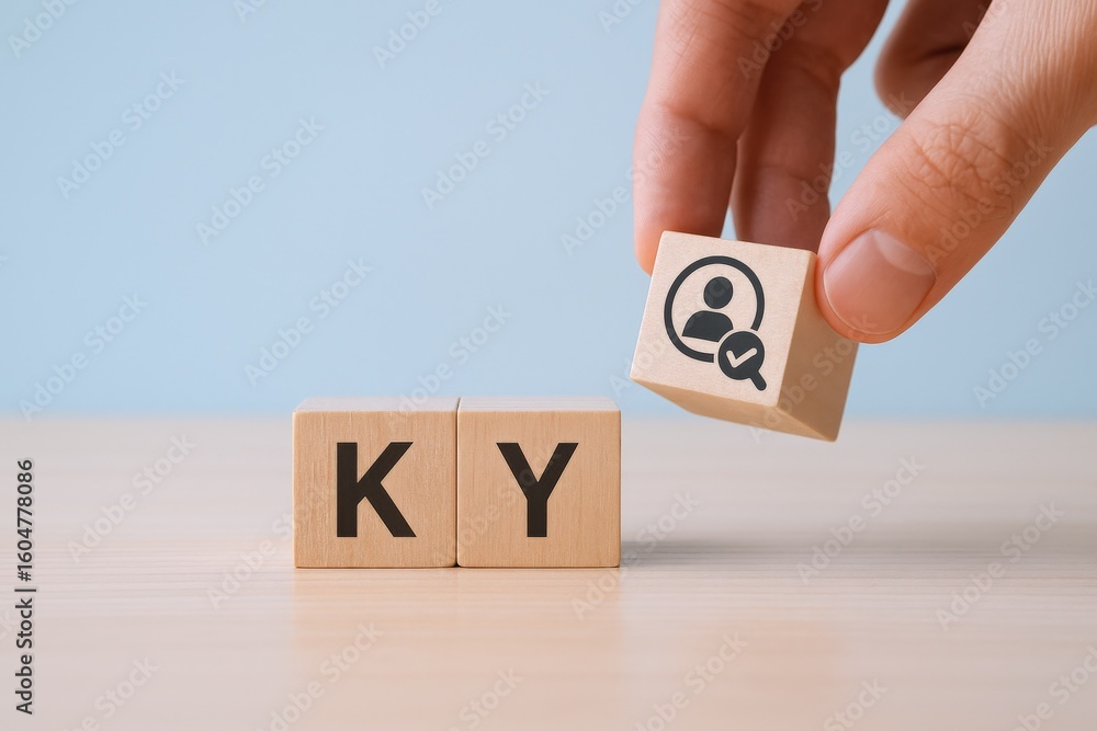 Poster close-up of a hand holding a wooden block with a user profile icon above two wooden cubes with the l