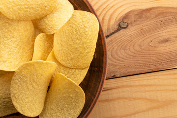 Crispy potato chips, top view, macro.