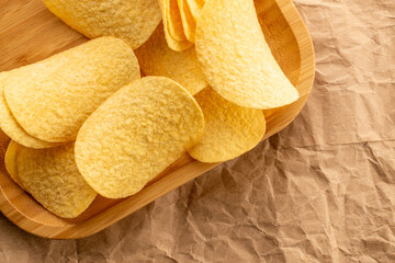 Crispy potato chips, top view, macro.