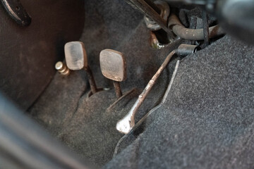 Close up of old and dirty car pedals showing wear and tear