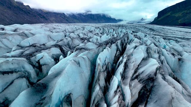 Explore the stunning formations of Skaftafell Glacier, characterized by intricate crevasses and breathtaking ice structures. Witness the dramatic beauty of Icelands natural wonders.