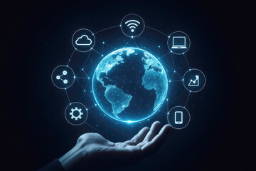 Fototapeta premium Glowing blue digital earth surrounded by technology icons held in an open hand globe