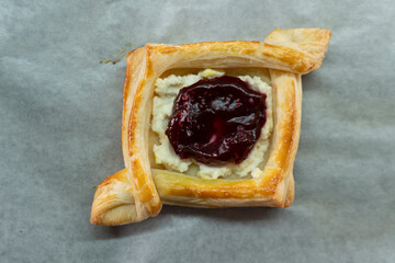 Puff pastry with jam and cream cheese. Dessert. Pastries. Food concept