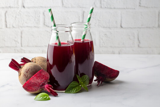 Glass of fresh beetroot juice or smoothie with vegetables - Powered by Adobe