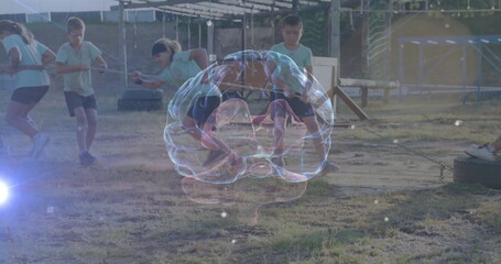 Six children in sportswear pulling rope during tug-of-war on field, with holographic brain model