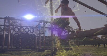 Climbing shirtless athlete scaling wooden beam at park with tire wall, digital overlay, copy space