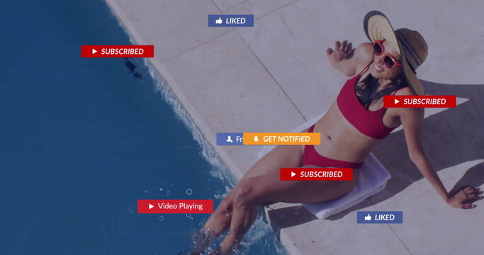 Reclining woman wearing red bikini sun hat, red sunglasses poolside displaying overlays, copy space - Powered by Adobe