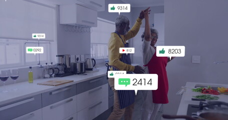 Dancing couple preparing meal in modern kitchen, with floating social icons and appliances