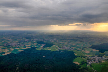 Area near Frankfurt Germany aerial view at sunset from airplane window before landing at airport