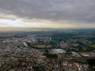 Frankfurt Germany city aerial view at sunset from airplane window before landing at airport