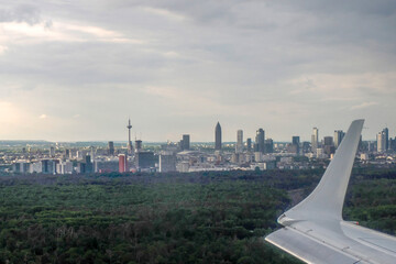 Frankfurt Germany city aerial view at sunset from airplane window before landing at airport