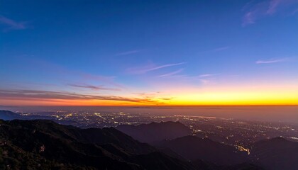 Panoramic sunset over city nestled in mountains