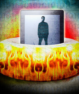 Ring of fire surrounding man and coding on digital tablet screen