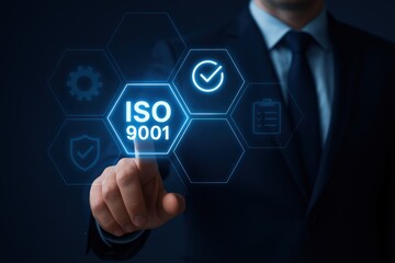 Businessman Touching ISO 9001 Certification Icon On Virtual Screen