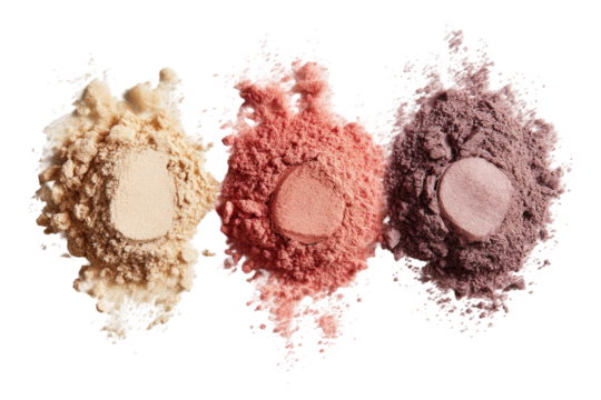Three piles of loose powder, light beige,  coral, and muted mauve,  spilled out