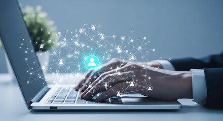 Hands typing on a laptop with a glowing network of people icons