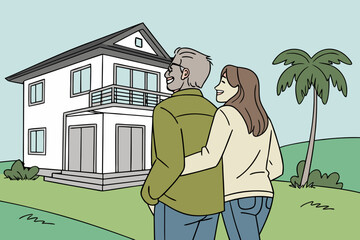 senior couple walking in front of house