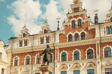 Town Hall in Vyborg with a monument to founder of Vyborg Castle, Torgils Knutsson