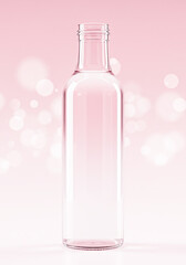 Clear glass bottle with pink liquid and soft bokeh background
