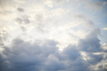 Calm sea under cloudy sky at sunset time