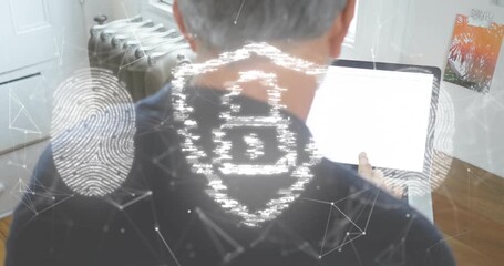 Man opening laptop and typing in office, authenticating with security shield and fingerprint icons - Powered by Adobe