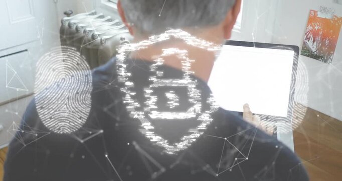 Man opening laptop and typing in office, authenticating with security shield and fingerprint icons