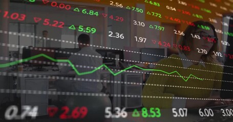 Man sitting on exercise ball while woman typing as financial stock tickers and line graphs updating - Powered by Adobe