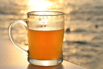 Beer Glass at Sunset with Sea Bokeh