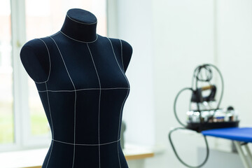 Close-up photo of a mannequin in a bright workshop
