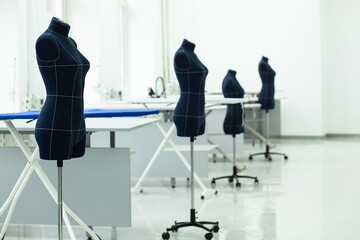 A spacious sewing workshop with mannequins