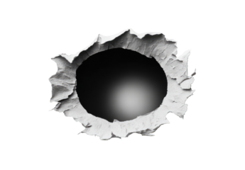 A cleanly punched hole in white paper