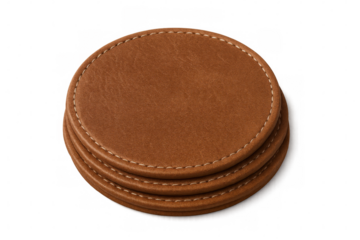 Four round leather coasters forming a neat stack, isolated on a transparent background, ready for customization or design projects