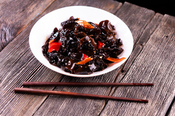 Wood Ear Mushroom Salad on wooden background. Chinese food. Asian cuisine