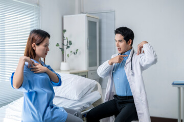 A doctor is pointing to a woman's chest