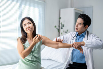 A woman is being treated by a doctor in a hospital