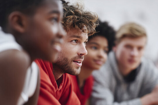 A diverse group looks forward, united and hopeful. Great for educational, team, youth, or community themes. Illustrates optimism and collaboration.