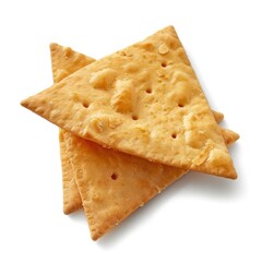 Fototapeta premium Stack of triangular crackers against white background