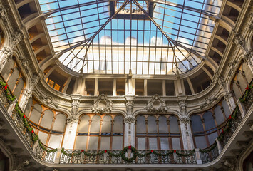 Detail of the iron and glass dome of the Galleria Subalpina (1874), historic shopping gallery in Art Nouveau style, Turin, Piedmont, Italy