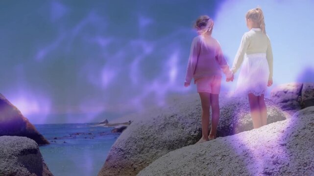 Tech showing sisters stepping onto boulder by ocean sparking swirling purple mist pointing to boat