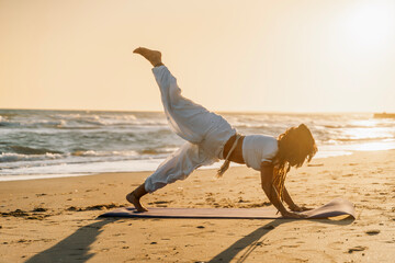 Yoga strength balance sunrise beach