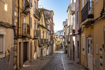 Narrow street Travesia Porta do Sol in the old town of Setubal in Portugal © rudiernst