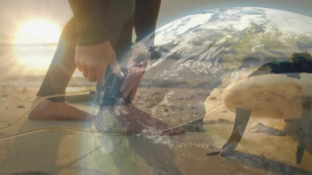 Sunrise causing surfer bending, wrapping leash, testing tension while globe overlay rotating