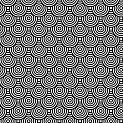A seamless pattern of densely arranged black and white concentric circles creates an optical visual effect. The design creates a retro, dynamic, and powerfully rhythmic feel. It's perfect for pop art 