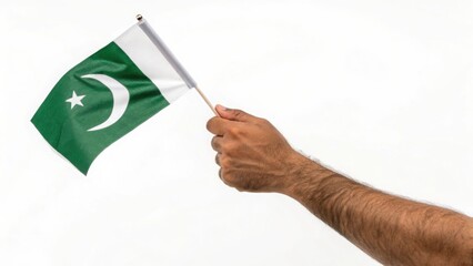 A proud hand waving the flag of Pakistan in a patriotic celebration of independence day clean white