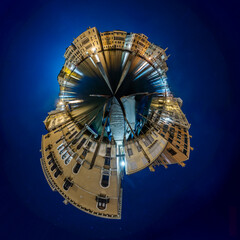 Venice Grand Canal at night with historic buildings, gondolas, and reflections under a starry sky.